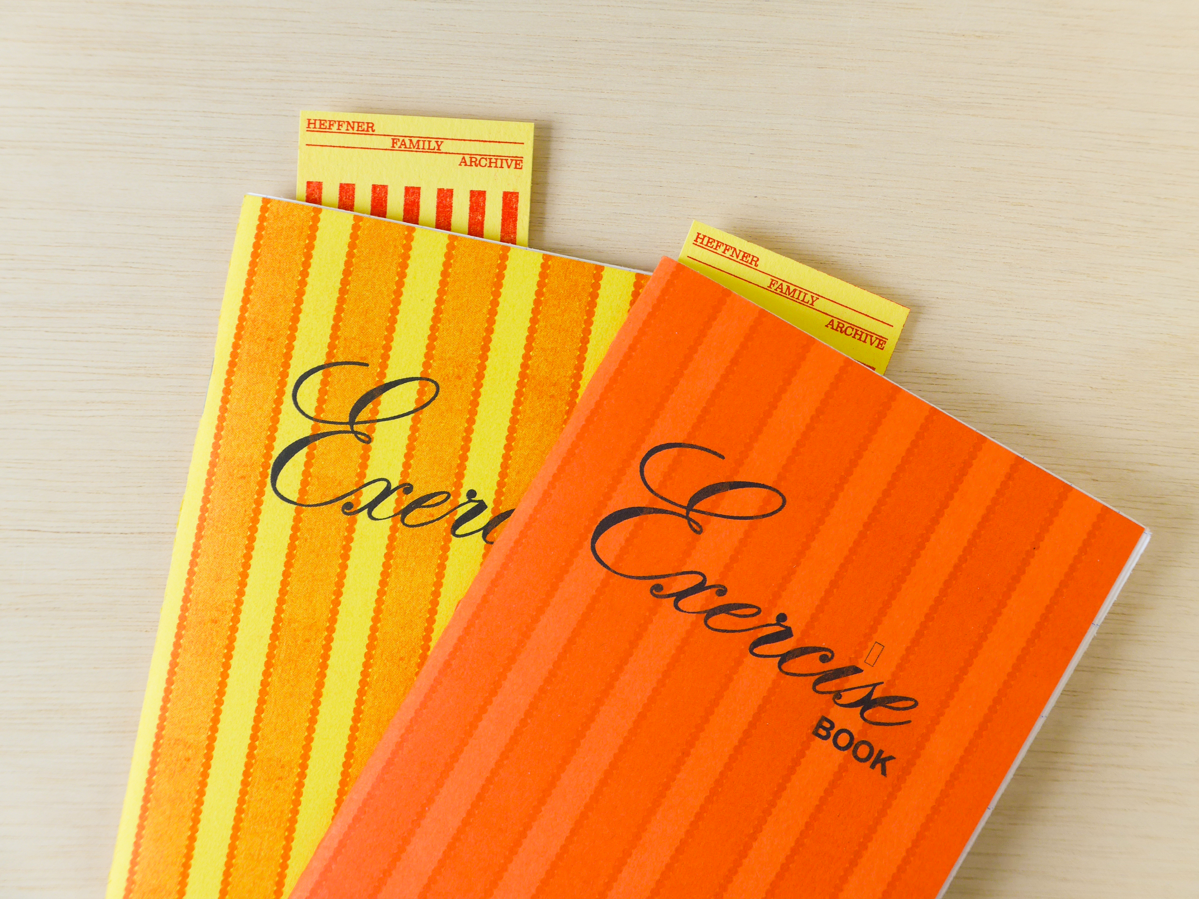 Two exercise books with archive tags